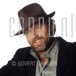 Peter Tuinman (Date Unknown) at studio in Amterdam.

[keywords]Posed, Headshot, Eyecontact, Smiling, Hat[/keywords]